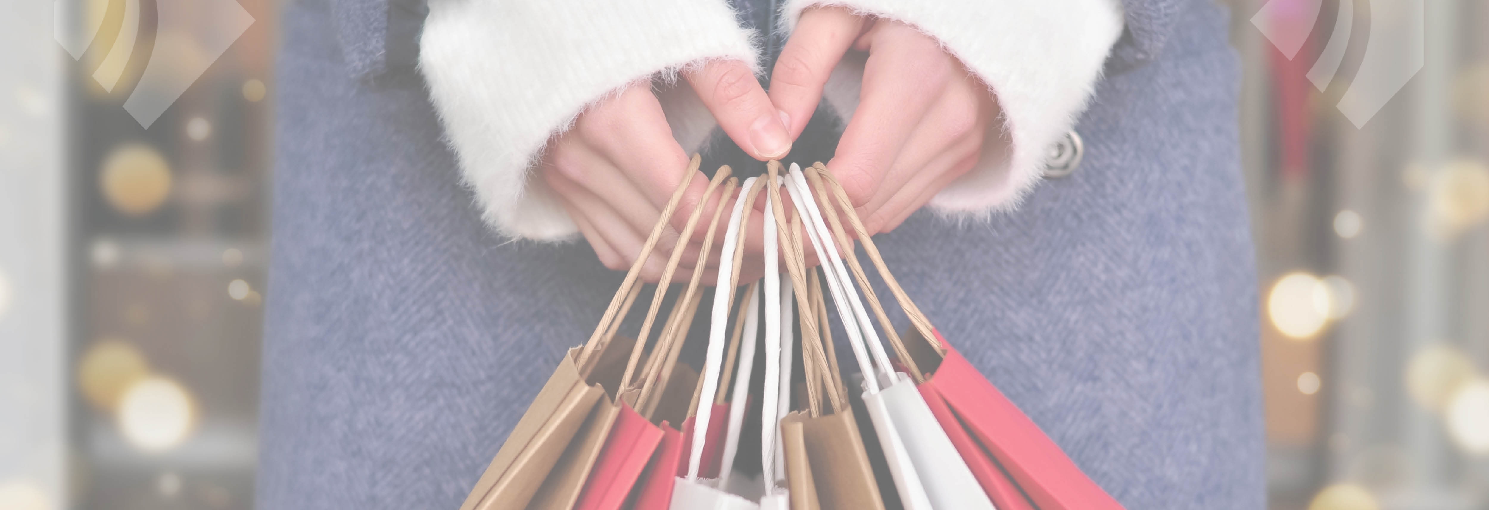 Woman holding Christmas gift bags