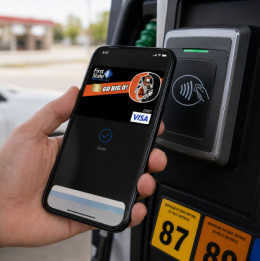person using their mobile wallet with a Beatrice debit card at a gas pump