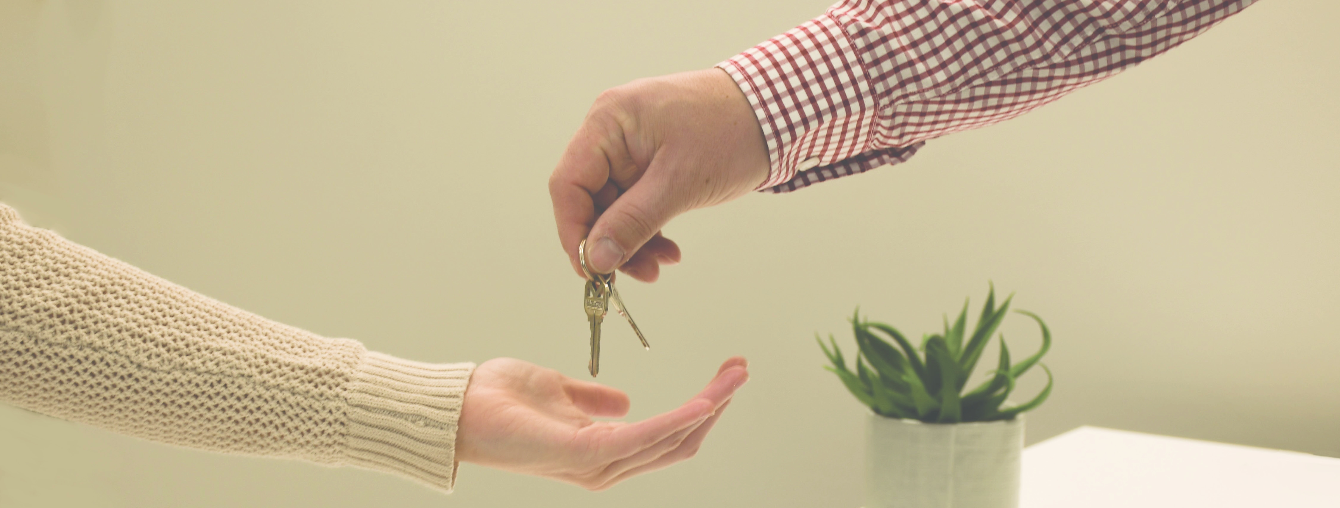 Realtor handing over keys to new house