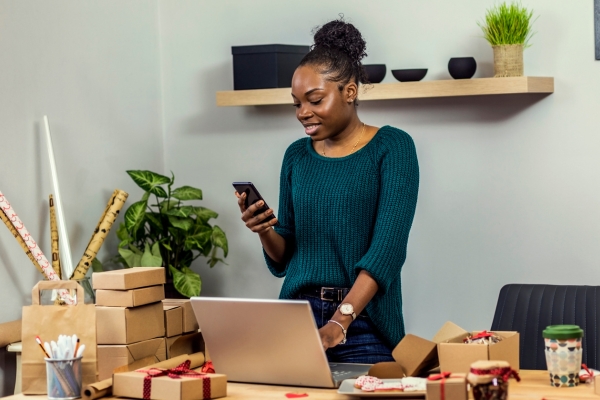 business owner working on her phone