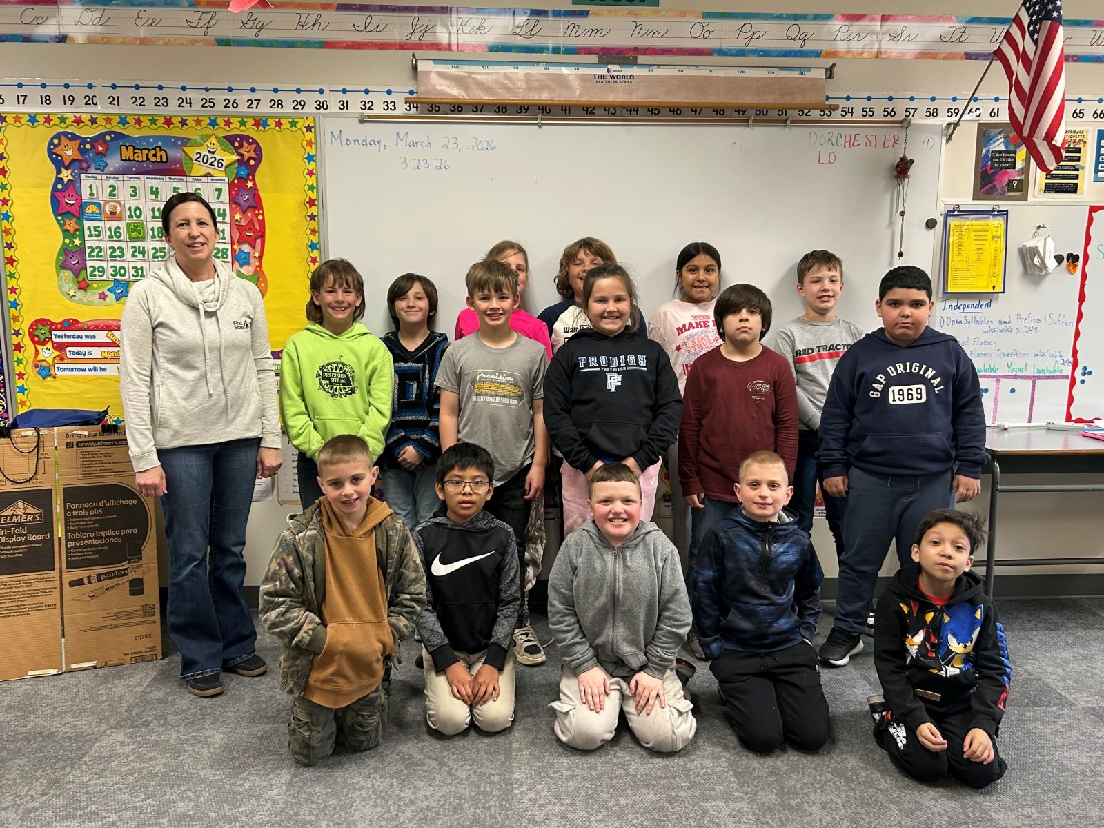 group of kids lined up in a classroom