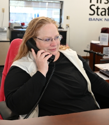 Bank employee explaining products to customer